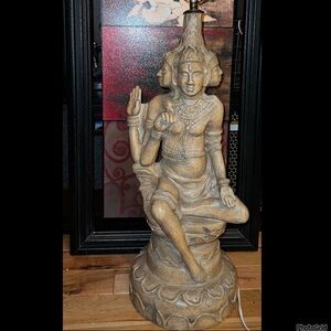Hindu hand carved vintage lamp. The Trimurti: three forms of the supreme being